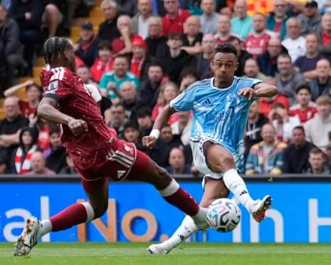 Nottingham Forest's Dan Ndoye strikes the ball as a Liverpool defender lunges to block