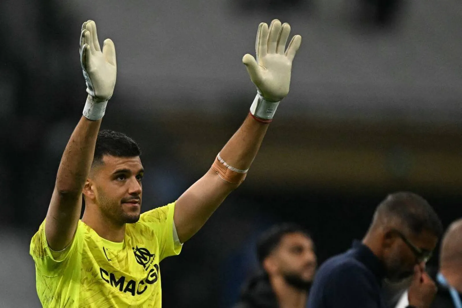Goalkeeper Geronimo Rulli waves to fans during his time as a Marseille player