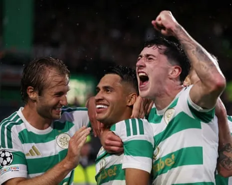 Celtic's Camilo Duran celebrates a goal with teammates, one raising a fist and shouting