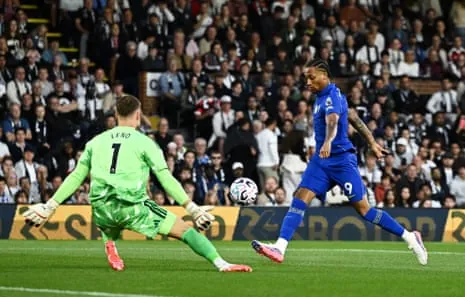 Chelsea’s Joao Pedro scores their first goal past Fulham’s Bernd Leno.