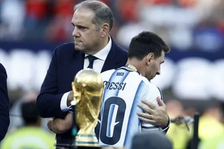 Canadian Victor Montagliani consoles Lionel Messi after the World Cup final
