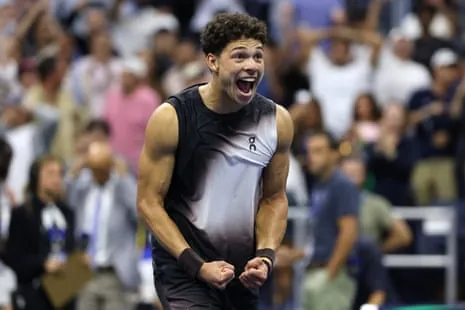 Ben Shelton celebrates after defeating Carlos Alcaraz in their US Open quarter-final.